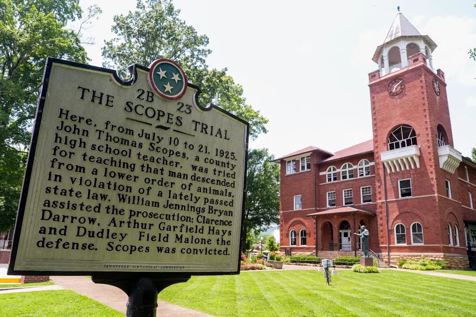 The Scopes Trial historical marker in front of the Rhea County Courthouse and its clock tower in Dayton, Tennessee