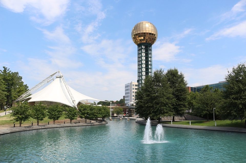 World's Fair Park in Knoxville, with the Tennessee Amphitheater tent and the Sunsphere tower beside the lake